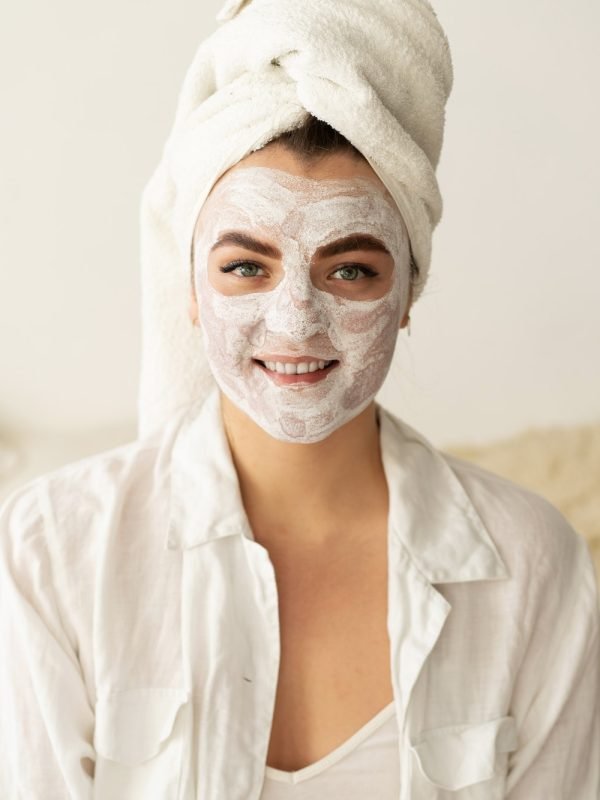 beautiful-woman-applying-facial-mask.jpg