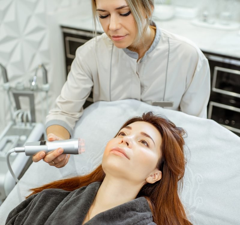 cosmetologist-making-facial-treatment-to-a-woman.jpg